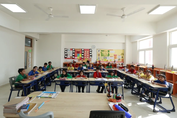 Students drafting and refining original stories in Writer's Workshop